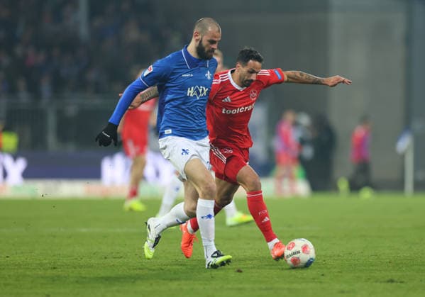 23.01.2026, Fussball 2. Bundesliga, SV Darmstadt 98 - 1. FC Nürnberg, emonline, emspor, despor, v.l., Aleksandar Vukotic (SV Darmstadt 98), Adriano Grimaldi (1. FC Nürnberg) DFL DFB REGULATIONS PROHIBIT ANY USE OF PHOTOGRAPHS AS IMAGE SEQUENCES AND OR QUASI-VIDEO. xdcx