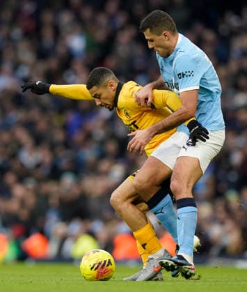 Manchester, England, 24th January 2026. Andre of Wolverhampton Wanderers (L) is challenged by Rodri of Manchester City during the Manchester City vs Wolverhampton Wanderers Premier League match at the Etihad Stadium, Manchester. Picture credit should read: Andrew Yates Sportimage EDITORIAL USE ONLY. No use with unauthorised audio, video, data, fixture lists, club league logos or live services. Online in-match use limited to 120 images, no video emulation. No use in betting, games or single club league player publications. SPI_017_AY_MAN_CITY_WOLVES SPI-4473-0017