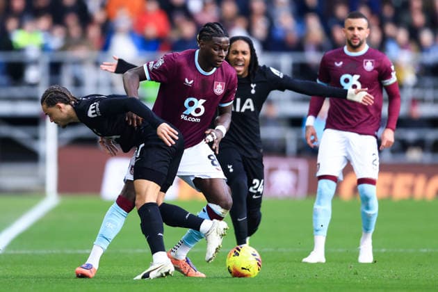 Burnley, England, 24th January 2026. Xavi Simons of Tottenham Hotspur is tackled by Lesley Ugochukwu of Burnley during the Burnley vs Tottenham Hotspur Premier League match at Turf Moor, Burnley. Picture credit should read: Jessica Hornby Sportimage EDITORIAL USE ONLY. No use with unauthorised audio, video, data, fixture lists, club league logos or live services. Online in-match use limited to 120 images, no video emulation. No use in betting, games or single club league player publications. SPI_037_JH_BURNLEY_TOTTENHAM SPI-4474-0036