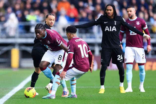 Burnley, England, 24th January 2026. Xavi Simons of Tottenham Hotspur is tackled by Lesley Ugochukwu of Burnley during the Burnley vs Tottenham Hotspur Premier League match at Turf Moor, Burnley. Picture credit should read: Jessica Hornby Sportimage EDITORIAL USE ONLY. No use with unauthorised audio, video, data, fixture lists, club league logos or live services. Online in-match use limited to 120 images, no video emulation. No use in betting, games or single club league player publications. SPI_039_JH_BURNLEY_TOTTENHAM SPI-4474-0038