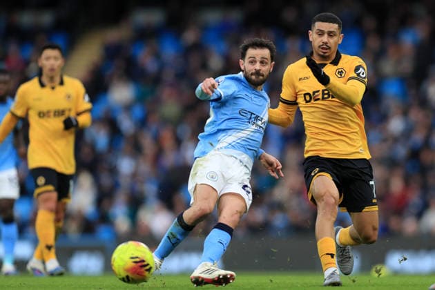 24th January 2026; Etihad Stadium, Manchester, Lancashire, England; Premier League Football, Manchester City versus Wolverhampton Wanderers; Bernardo Silva of Manchester City passes the ball under pressure from Andre of Wolverhampton Wanderers  DavidxBlunsden Content restricted for UK based newspaper