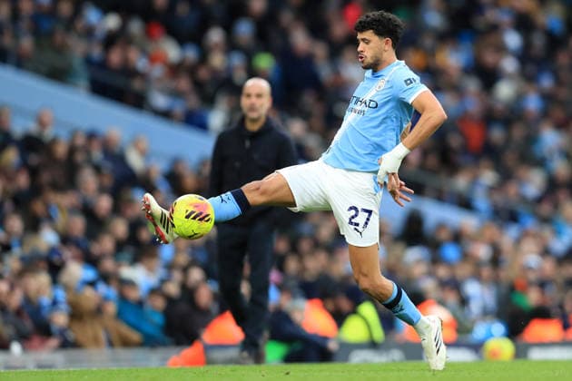 24th January 2026; Etihad Stadium, Manchester, Lancashire, England; Premier League Football, Manchester City versus Wolverhampton Wanderers; Matheus Nunes of Manchester City controls the ball watched by manager Pep Guardiola  DavidxBlunsden Content restricted for UK based newspaper