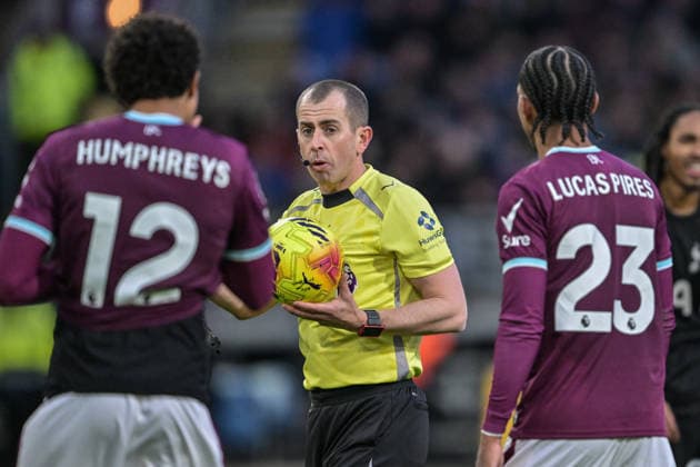 24th January 2026; Turf Moor, Burnley, Lancashire, England; Premier League Football, Burnley versus Tottenham Hotspur; match referee Peter Bankes speaks to Burnley players  LeexDurkin Content restricted for UK based newspaper