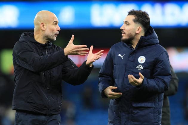 24th January 2026; Etihad Stadium, Manchester, Lancashire, England; Premier League Football, Manchester City versus Wolverhampton Wanderers; Manchester City manager Pep Guardiola speaks with Rayan Cherki at full time  DavidxBlunsden Content restricted for UK based newspaper