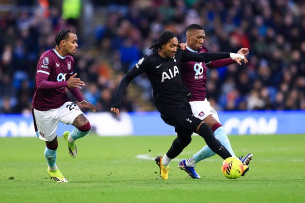 Burnley, England, 24th January 2026. Djed Spence of Tottenham Hotspur is challenged by Lucas Pires (L) and Jaidon Anthony of Burnley during the Burnley vs Tottenham Hotspur Premier League match at Turf Moor, Burnley. Picture credit should read: Jessica Hornby Sportimage EDITORIAL USE ONLY. No use with unauthorised audio, video, data, fixture lists, club league logos or live services. Online in-match use limited to 120 images, no video emulation. No use in betting, games or single club league player publications. SPI_060_JH_BURNLEY_TOTTENHAM SPI-4474-0059