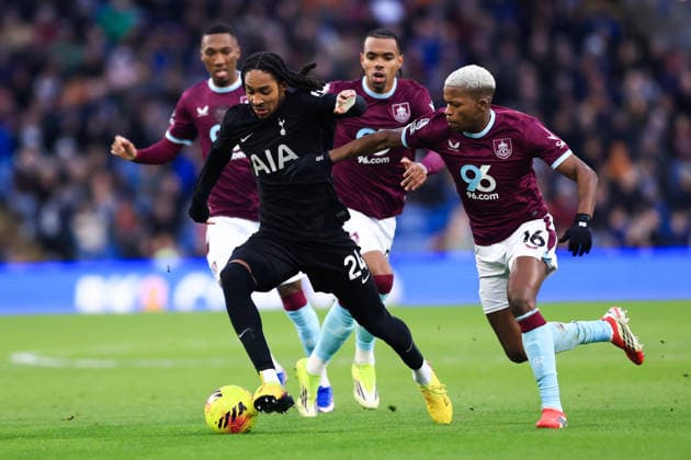 Burnley, England, 24th January 2026. Djed Spence of Tottenham Hotspur is challenged by Florentino Luis of Burnley during the Burnley vs Tottenham Hotspur Premier League match at Turf Moor, Burnley. Picture credit should read: Jessica Hornby Sportimage EDITORIAL USE ONLY. No use with unauthorised audio, video, data, fixture lists, club league logos or live services. Online in-match use limited to 120 images, no video emulation. No use in betting, games or single club league player publications. SPI_063_JH_BURNLEY_TOTTENHAM SPI-4474-0062