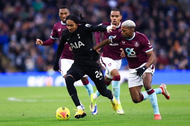 Burnley, England, 24th January 2026. Djed Spence of Tottenham Hotspur is challenged by Florentino Luis of Burnley during the Burnley vs Tottenham Hotspur Premier League match at Turf Moor, Burnley. Picture credit should read: Jessica Hornby Sportimage EDITORIAL USE ONLY. No use with unauthorised audio, video, data, fixture lists, club league logos or live services. Online in-match use limited to 120 images, no video emulation. No use in betting, games or single club league player publications. SPI_064_JH_BURNLEY_TOTTENHAM SPI-4474-0063