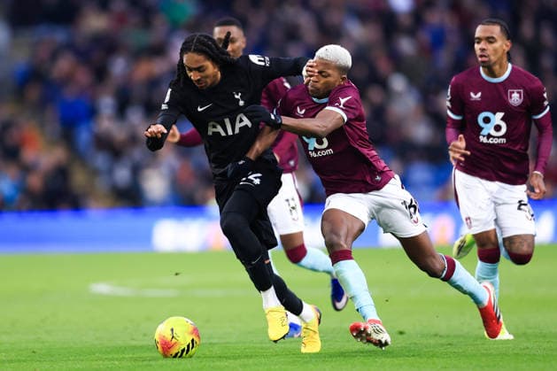 Burnley, England, 24th January 2026. Djed Spence of Tottenham Hotspur is challenged by Florentino Luis of Burnley during the Burnley vs Tottenham Hotspur Premier League match at Turf Moor, Burnley. Picture credit should read: Jessica Hornby Sportimage EDITORIAL USE ONLY. No use with unauthorised audio, video, data, fixture lists, club league logos or live services. Online in-match use limited to 120 images, no video emulation. No use in betting, games or single club league player publications. SPI_066_JH_BURNLEY_TOTTENHAM SPI-4474-0065