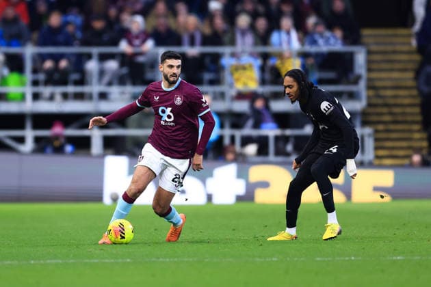 Burnley, England, 24th January 2026. Armando Broja of Burnley runs with the ball whilst under pressure from Djed Spence of Tottenham Hotspur during the Burnley vs Tottenham Hotspur Premier League match at Turf Moor, Burnley. Picture credit should read: Jessica Hornby Sportimage EDITORIAL USE ONLY. No use with unauthorised audio, video, data, fixture lists, club league logos or live services. Online in-match use limited to 120 images, no video emulation. No use in betting, games or single club league player publications. SPI_074_JH_BURNLEY_TOTTENHAM SPI-4474-0073
