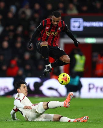 Bournemouth, England, 24th January 2026. Wataru Endo of Liverpool and Eli Junior Kroupi of Bournemouth challenge for the ball during the AFC Bournemouth vs Liverpool Premier League match at the Vitality Stadium, Bournemouth. Picture credit should read: Paul Terry Sportimage EDITORIAL USE ONLY. No use with unauthorised audio, video, data, fixture lists, club league logos or live services. Online in-match use limited to 120 images, no video emulation. No use in betting, games or single club league player publications. SPI_023_PT_Bournemouth_Liverpool SPI-4475-0023