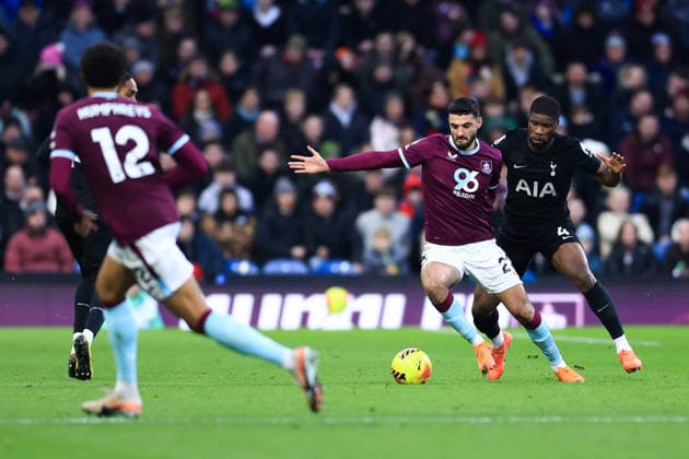 Burnley, England, 24th January 2026. Armando Broja of Burnley is challenged by Kevin Danso of Tottenham Hotspur during the Burnley vs Tottenham Hotspur Premier League match at Turf Moor, Burnley. Picture credit should read: Jessica Hornby Sportimage EDITORIAL USE ONLY. No use with unauthorised audio, video, data, fixture lists, club league logos or live services. Online in-match use limited to 120 images, no video emulation. No use in betting, games or single club league player publications. SPI_100_JH_BURNLEY_TOTTENHAM SPI-4474-0099