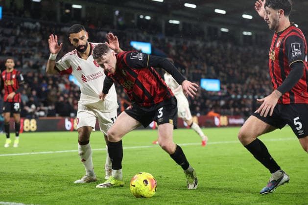 Bournemouth v Liverpool 24 January 2026, Bournemouth - Premier League Football - AFC Bournemouth v Liverpool - Mohamed Salah of Liverpool and Adrien Truffert of Bournemouth watch as Marcos Senesi of Bournemouth clears the ball - Photo: Charlotte Wilson Offside. Bournemouth UK Copyright: xCharlottexWilsonx xOffsidexOffside
