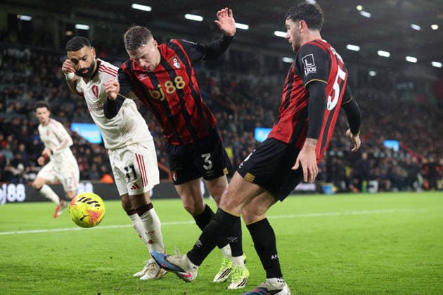 Bournemouth v Liverpool 24 January 2026, Bournemouth - Premier League Football - AFC Bournemouth v Liverpool - Mohamed Salah of Liverpool and Adrien Truffert of Bournemouth watch as Marcos Senesi of Bournemouth clears the ball - Photo: Charlotte Wilson Offside. Bournemouth UK Copyright: xCharlottexWilsonx xOffsidexOffside