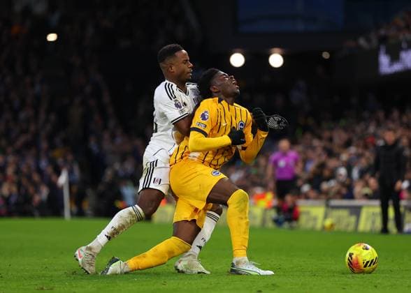 24th January 2026; Craven Cottage, Fulham, London, England; Premier League Football, Fulham versus Brighton and Hove Albion; Carlos Baleba of Brighton &amp; Hove Albion under pressure from Ryan Sessegnon of Fulham  JohnxPatrickxFletcher Content restricted for UK based newspaper