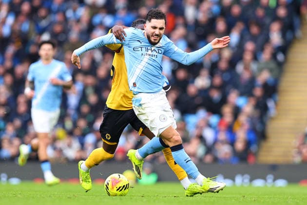 Manchester City v Wolverhampton Wanderers, Premier League Rayan Cherki of Manchester City is challenged for possession by Mateus Mane of Wolverhampton Wanderers during the Manchester City v Wolverhampton Wanderers Premier League match at the Etihad Stadium, Manchester, England on 24 January 2026 Credit: Ryan Crockett Every Second Media Editorial use only. All images are copyright Every Second Media Limited. No images may be reproduced without prior permission. All rights reserved. Premier League and Football League images are subject to licensing agreements with Football DataCo Limited. see https: www.football-dataco.com Copyright: xIMAGO EveryxSecondxMediax ESM-1769-0195 RyanxCrockettx xEveryxSecondxMediax