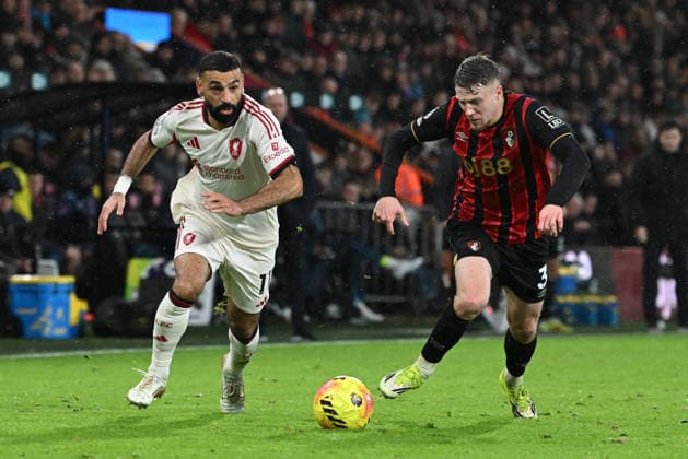 Bournemouth v Liverpool, Premier League Mohamed Salah (11) of Liverpool on the attack battles for possession with Adrien Truffert (3) of AFC Bournemouth during the Premier League match between Bournemouth and Liverpool at the Vitality Stadium, Bournemouth, UK on 24 January 2026. Bournemouth Vitality Stadium Dorset UK Editorial use only DataCo restrictions apply See www.football-dataco.com , Copyright: xGrahamxHuntx PSI-23639-0268