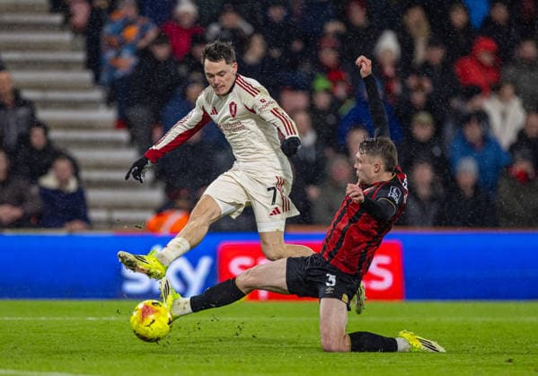 (260125) -- BOURNEMOUTH, Jan. 25, 2026 () -- Liverpool s Florian Wirtz (L) is challenged by Bournemouth s Adrien Truffert during the English Premier League match between Bournemouth and Liverpool in Bournemouth, Britain, on Jan. 24, 2026. () FOR EDITORIAL USE ONLY. NOT FOR SALE FOR MARKETING OR ADVERTISING CAMPAIGNS. NO USE WITH UNAUTHORIZED AUDIO, VIDEO, DATA, FIXTURE LISTS, CLUB LEAGUE LOGOS OR LIVE SERVICES. ONLINE IN-MATCH USE LIMITED TO 45 IMAGES, NO VIDEO EMULATION. NO USE IN BETTING, GAMES OR SINGLE CLUB LEAGUE PLAYER PUBLICATIONS. (SP)BRITAIN-BOURNEMOUTH-FOOTBALL-PREMIER LEAGUE-BOURNEMOUT VS LIVERPOOL Xinhua 