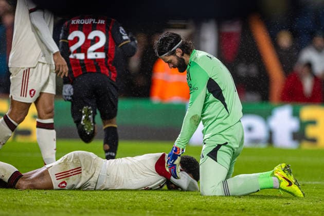 (260125) -- BOURNEMOUTH, Jan. 25, 2026 () -- Liverpool s Joe Gomez (down) lies and goalkeeper Alisson Becker looks dejected as Bournemouth score the opening goal during the English Premier League match between Bournemouth and Liverpool in Bournemouth, Britain, on Jan. 24, 2026. () FOR EDITORIAL USE ONLY. NOT FOR SALE FOR MARKETING OR ADVERTISING CAMPAIGNS. NO USE WITH UNAUTHORIZED AUDIO, VIDEO, DATA, FIXTURE LISTS, CLUB LEAGUE LOGOS OR LIVE SERVICES. ONLINE IN-MATCH USE LIMITED TO 45 IMAGES, NO VIDEO EMULATION. NO USE IN BETTING, GAMES OR SINGLE CLUB LEAGUE PLAYER PUBLICATIONS. (SP)BRITAIN-BOURNEMOUTH-FOOTBALL-PREMIER LEAGUE-BOURNEMOUT VS LIVERPOOL Xinhua 