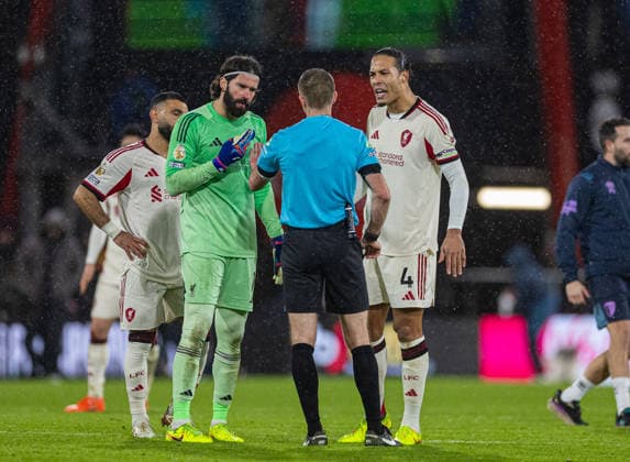 (260125) -- BOURNEMOUTH, Jan. 25, 2026 () -- Liverpool s goalkeeper Alisson Becker (2nd L) and captain Virgil van Dijk (1st R) protest after Bournemouth score the winning goal in the 95th minute during the English Premier League match between Bournemouth and Liverpool in Bournemouth, Britain, on Jan. 24, 2026. () FOR EDITORIAL USE ONLY. NOT FOR SALE FOR MARKETING OR ADVERTISING CAMPAIGNS. NO USE WITH UNAUTHORIZED AUDIO, VIDEO, DATA, FIXTURE LISTS, CLUB LEAGUE LOGOS OR LIVE SERVICES. ONLINE IN-MATCH USE LIMITED TO 45 IMAGES, NO VIDEO EMULATION. NO USE IN BETTING, GAMES OR SINGLE CLUB LEAGUE PLAYER PUBLICATIONS. (SP)BRITAIN-BOURNEMOUTH-FOOTBALL-PREMIER LEAGUE-BOURNEMOUT VS LIVERPOOL Xinhua 