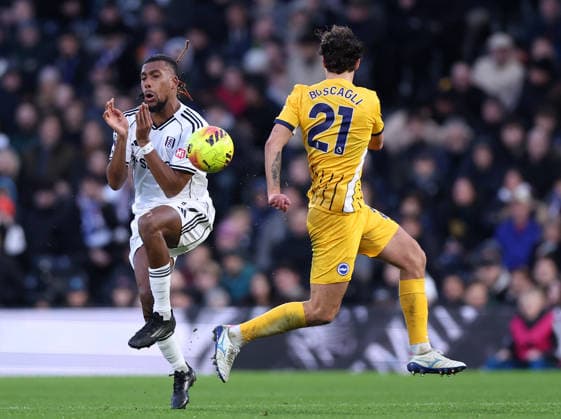 London, England, 24th January 2026. Alex Iwobi of Fulham with Olivier Boscagli of Brighton during the Fulham vs Brighton and Hove Albion Premier League match at Craven Cottage, London. Picture credit should read: David Klein Sportimage EDITORIAL USE ONLY. No use with unauthorised audio, video, data, fixture lists, club league logos or live services. Online in-match use limited to 120 images, no video emulation. No use in betting, games or single club league player publications. SPI_086_DK_FULHAM_BRIGHTON SPI-4482-0078