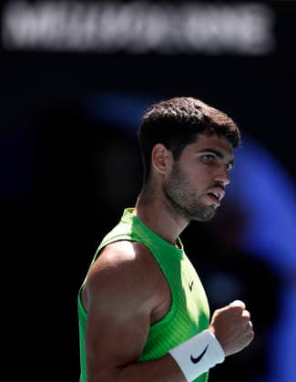 (260125) -- MELBOURNE, Jan. 25, 2026 -- Carlos Alcaraz of Spain reacts during the men s singles 4th round match between Carlos Alcaraz of Spain and Tommy Paul of the United States at the Australian Open tennis tournament in Melbourne, Australia, Jan. 25, 2026. ) (SP)AUSTRALIA-MELBOURNE-TENNIS-AUSTRALIAN OPEN-MEN S SINGLES MaxPing 