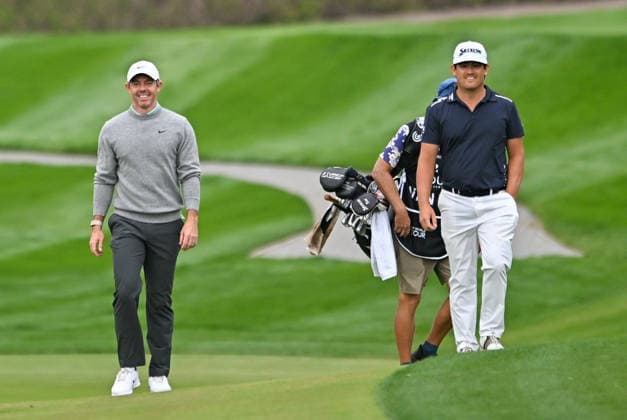 Hero Dubai Desert Classic 2026 in UAE DUBAI, UNITED ARAB EMIRATES - JANUARY 25: Northern Irish golfer Rory McIlroy (L) and Dutch golfer Darius van Driel (R) walk onto the course to compete in the fourth and final round of the Hero Dubai Desert Classic 2026 at Emirates Golf Club in Dubai, United Arab Emirates on January 25, 2026. Waleed Zein Anadolu Dubai United Arab Emirates. Editorial use only. Please get in touch for any other usage.  Copyright: x2026xAnadoluxWaleedxZeinx