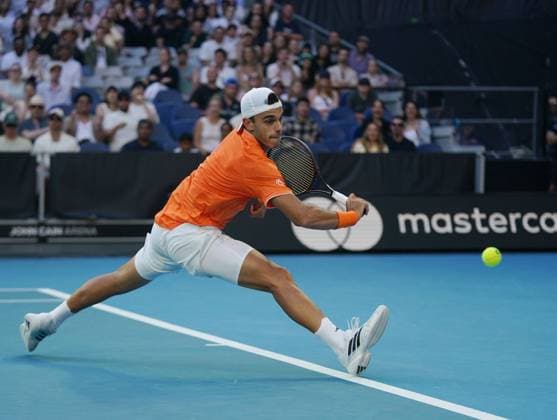(260125) -- MELBOURNE, Jan. 25, 2026 -- Francisco Cerundolo hits a return during the men s singles 4th round match between Alexander Zverev of Germany and Francisco Cerundolo of Argentina at the Australian Open tennis tournament in Melbourne, Australia, Jan. 25, 2026. (Photo by Xinhua) (SP)AUSTRALIA-MELBOURNE-TENNIS-AUSTRALIAN OPEN-MEN S SINGLES WangxShen 