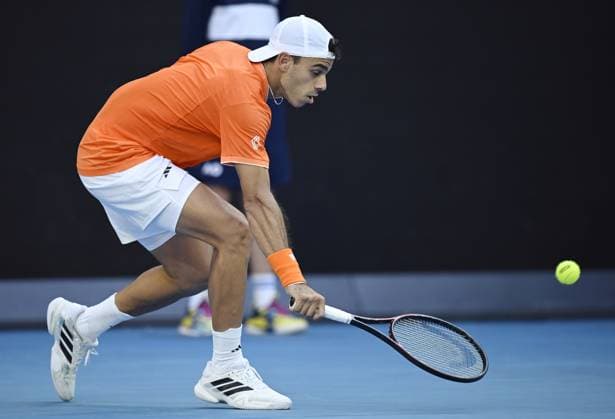 (260125) -- MELBOURNE, Jan. 25, 2026 -- Francisco Cerundolo hits a return during the men s singles 4th round match between Alexander Zverev of Germany and Francisco Cerundolo of Argentina at the Australian Open tennis tournament in Melbourne, Australia, Jan. 25, 2026. (Photo by Xinhua) (SP)AUSTRALIA-MELBOURNE-TENNIS-AUSTRALIAN OPEN-MEN S SINGLES WangxShen 