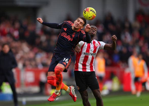 25th January 2026; Gtech Community Stadium, Brentford, London, England; Premier League Football, Brentford versus Nottingham Forest; Nicolas Dominguez of Nottingham Forest heads the ball over Michael Kayode of Brentford  JohnxPatrickxFletcher
