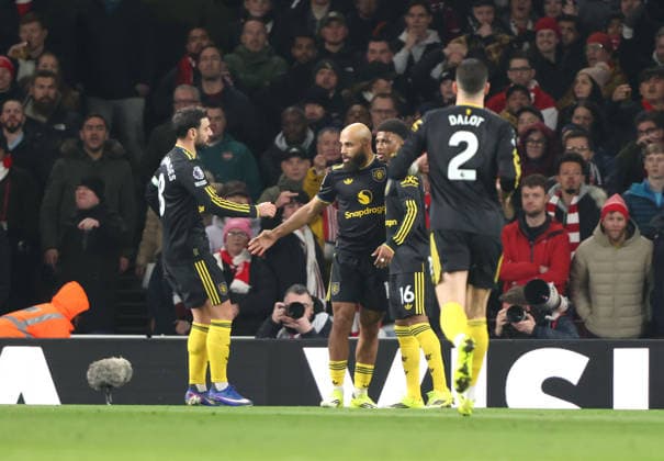 Man Utd players congratulate Bryan Mbeumo (MU) after he scored the first Arsenal goal (1-1) at the Arsenal v Manchester United, ManU EPL match, at the Emirates Stadium, London, UK on 25th January, 2026. 