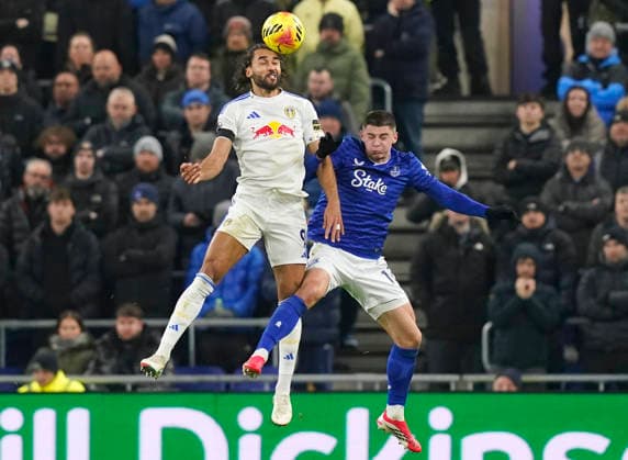 Liverpool, England, 26th January 2026. Dominic Calvert-Lewin of Leeds United tussles with Vitalii Mykolenko of Everton during the Everton vs Leeds United Premier League match at Hill Dickinson Stadium, Liverpool. Picture credit should read: Andrew Yates Sportimage EDITORIAL USE ONLY. No use with unauthorised audio, video, data, fixture lists, club league logos or live services. Online in-match use limited to 120 images, no video emulation. No use in betting, games or single club league player publications. SPI_027_AY_Everton_Leeds SPI-4481-0027