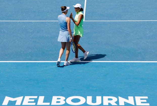 (260128) -- MELBOURNE, Jan. 28, 2026 -- Zhang Shuai (R) Elise Mertens react during the women s doubles quarterfinal match between Zhang Shuai (China) Elise Mertens (Belgium) and Wu Fang-Hsien (Chinese Taipei) Hozumi Eri (Japan) at the Australian Open tennis tournament in Melbourne, Australia, Jan. 28, 2026. ) (SP)AUSTRALIA-MELBOURNE-TENNIS-AUSTRALIAN OPEN-WOMEN S DOUBLES-QUARTERFINALS MaxPing 