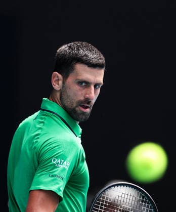(260128) -- MELBOURNE, Jan. 28, 2026 -- Novak Djokovic of Serbia reacts during the men s singles quarterfinal match between Novak Djokovic of Serbia and Lorenzo Musetti of Italy at the Australian Open tennis tournament in Melbourne, Australia, Jan. 28, 2026. ) (SP)AUSTRALIA-MELBOURNE-TENNIS-AUSTRALIAN OPEN-MEN S SINGLES-QUARTERFINALS MaxPing 