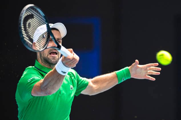 (260128) -- MELBOURNE, Jan. 28, 2026 -- Novak Djokovic of Serbia hits a return during the men s singles quarterfinal match between Novak Djokovic of Serbia and Lorenzo Musetti of Italy at the Australian Open tennis tournament in Melbourne, Australia, Jan. 28, 2026. (Photo by Xinhua) (SP)AUSTRALIA-MELBOURNE-TENNIS-AUSTRALIAN OPEN-MEN S SINGLES-QUARTERFINALS HuxJingchen 