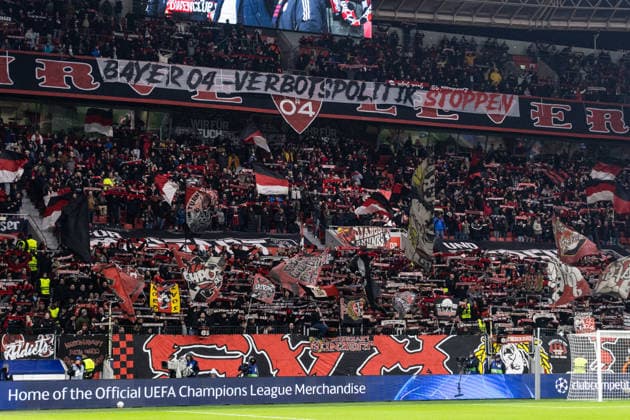 UEFA Champions League: Bayer 04 Leverkusen - Villarreal FC; 28.01.2026 Fans von Bayer 04 Leverkusen mit dem Banner BAYER 04 - Verbotspolitik stoppen UEFA Champions League: Bayer 04 Leverkusen - Villarreal FC; BayArena, Leverkusen; 28.01.2026 Copyright: xBEAUTIFULxSPORTS Buriakovx