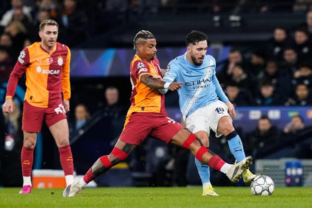 Manchester, England, 28th January 2026. Mario Lemina of Galatasaray tackles Rayan Cherki of Manchester City during the Manchester City vs Galatasaray UEFA Champions League match at the Etihad Stadium, Manchester. Picture credit should read: Andrew Yates Sportimage EDITORIAL USE ONLY. No use with unauthorised audio, video, data, fixture lists, club league logos or live services. Online in-match use limited to 120 images, no video emulation. No use in betting, games or single club league player publications. SPI_032_AY_Man_City_Galatasaray SPI-4489-0063
