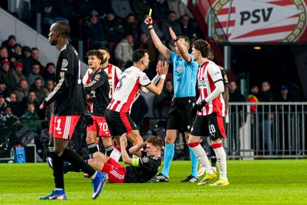 Referee Joao Pinheiro shows a yellow card to Ivan Perisic of PSV Eindhoven PSV Eindhoven v FC Bayern Munchen, UEFA Champions League 2025 26 League Phase MD8, PSV Eindhoven v FC Bayern Munchen, PSV Stadion, January 28, 2026, Eindhoven, Netherlands.