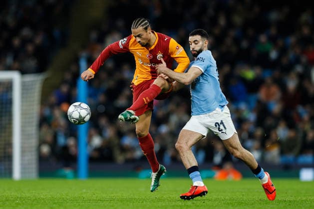 Manchester, England, 28th January 2026. Leroy Sane of Galatasaray passes the ball whilst getting pressured by Rayan Alt-Nouri of Manchester City during the Manchester City vs Galatasaray UEFA Champions League match at the Etihad Stadium, Manchester. Picture credit should read: Cody Froggatt Sportimage EDITORIAL USE ONLY. No use with unauthorised audio, video, data, fixture lists, club league logos or live services. Online in-match use limited to 120 images, no video emulation. No use in betting, games or single club league player publications. SPI_033_CF_Man_City_Galatasaray SPI-4489-0074