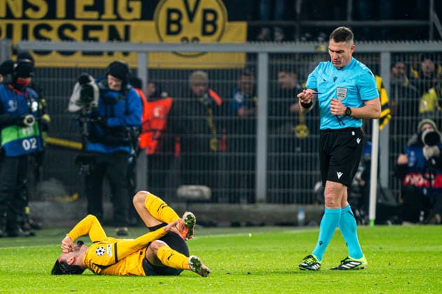 2026-01-28 Borussia Dortmund v FC Internazionale Milano - UEFA Champions League 2025 26 League Phase MD8 DORTMUND, GERMANY - JANUARY 28: referee Istvan Kovacs looks at Ramy Bensebaini of Borussia Dortmund on the ground during the UEFA Champions League 2025 26 League Phase MD8 match between Borussia Dortmund and FC Internazionale Milano at BVB Stadion Dortmund on January 28, 2026 in Dortmund, Germany. (Photo by Gabriel Calvino Alonso BSR Agency) Dortmund Germany Content not available for redistribution in The Netherlands directly or indirectly through any third parties. Copyright: xBSRxAgencyx
