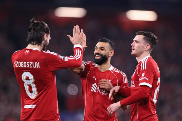 Football - UEFA Champions League - League Phase - Liverpool v Qarabag 28th January 2026 - UEFA Champions League - League Phase - Liverpool v Qarabag - Mohamed Salah of Liverpool (C) celebrates with Dominik Szoboszlai of Liverpool (L) and Andrew Robertson of Liverpool after scoring their 3rd goal - Photo: Simon Stacpoole Offside. Manchester UK Copyright: xSimonxStacpoolexOffside