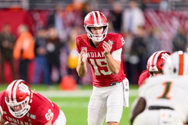 MIAMI GARDENS, FL - JANUARY 19: QB Fernando Mendoza 15 of the Indiana Hoosiers prepares to take the snap of the ball at the line of scrimmage during the Indiana Hoosiers versus the Miami Hurricanes College Football Playoff National Championship Game Presented by AT&T on January 19, 2026, at Hard Rock Stadium in Miami Gardens, FL. (Photo by Doug Murray Icon Sportswire) COLLEGE FOOTBALL: JAN 19 College Football Playoff National Championship Presented by AT&T Indiana vs Miami EDITORIAL USE ONLY Icon796260119134
