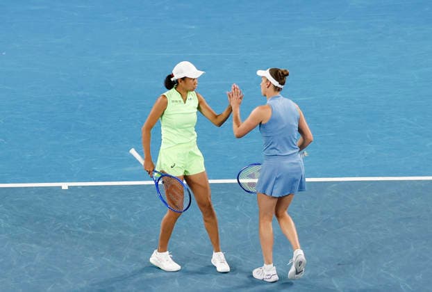 (260129) -- MELBOURNE, Jan. 29, 2026 -- Zhang Shuai (L) Elise Mertens react during the women s doubles semifinal match between Zhang Shuai (China) Elise Mertens (Belgium) and Shibahara Ena (Japan) Vera Zvonareva (Russia) at the Australian Open tennis tournament in Melbourne, Australia, Jan. 29, 2026. ) (SP)AUSTRALIA-MELBOURNE-TENNIS-AUSTRALIAN OPEN-WOMEN S DOUBLES-SEMIFINALS MaxPing 