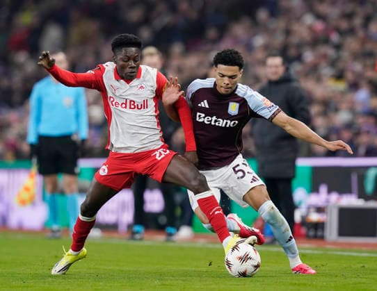 Birmingham, England, 29th January 2026. Edmund Baidoo of Red Bull Salzburg tackles George Hemmings of Aston Villa during the Aston Villa vs FC Salzburg UEFA Europa League match at Villa Park, Birmingham. Picture credit should read: Andrew Yates Sportimage EDITORIAL USE ONLY. No use with unauthorised audio, video, data, fixture lists, club league logos or live services. Online in-match use limited to 120 images, no video emulation. No use in betting, games or single club league player publications. SPI_031_AY_Villa_Salzburg SPI-4490-0031