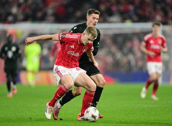 Birmingham, England, 29th January 2026. Zach Abbott of Nottingham Forest tussles with Kristoffer Zachariassen of Ferencvaros during the Aston Villa vs FC Salzburg UEFA Europa League match at Villa Park, Birmingham. Picture credit should read: Andrew Yates Sportimage EDITORIAL USE ONLY. No use with unauthorised audio, video, data, fixture lists, club league logos or live services. Online in-match use limited to 120 images, no video emulation. No use in betting, games or single club league player publications. SPI_055_HM_Forest_Ferencvaros SPI-4490-0061