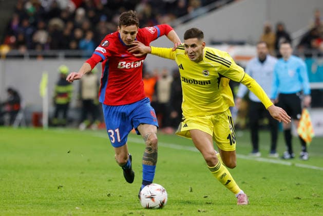 (260130) -- BUCHAREST, Jan. 30, 2026 -- FCSB s Juri Cisotti (L) vies with Fenerbahce s Mert Muldur during the UEFA Europa League football match between Fenerbahce and FCSB at Arena Nationala stadium in Bucharest, Romania, Jan. 29, 2026. (Photo by Xinhua) (SP)ROMANIA-BUCHAREST-FOOTBALL-UEFA EUROPA LEAGUE-FCSB VS FENERBAHCE CristianxCristel 