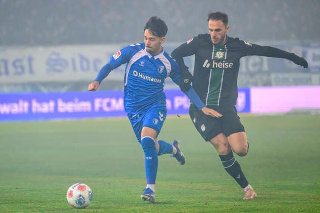 In the picture, from left: Laurin Ulrich (1. FC Magdeburg), Virgil¯GhiÅ£a¯(Hannover¯96), Action, duels, fighting for the ball, GER, Magdeburg, 1.FC Magdeburg vs Hannover 96, 2. Bundesliga, soccer, DFB, 2025 2026 season, AVNET Arena, match day, DFB DFL REGULATIONS PROHIBIT ANY USE OF PHOTOGRAPHS AS IMAGE SEQUENCES AND OR QUASI-VIDEO, 30.01.2026,