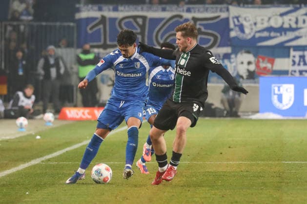 30.01.2026, xgox, Fussball 2. Bundesliga, 1. FC Magdeburg - Hannover 96 emspor, v.l. Laurin Ulrich (Magdeburg, 8), Benjamin Källman (Hannover, 9) Freisteller, Einzelbild, Ganzkoerper, single frame (DFL DFB REGULATIONS PROHIBIT ANY USE OF PHOTOGRAPHS as IMAGE SEQUENCES and or QUASI-VIDEO) Magdeburg