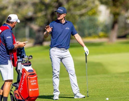 LA JOLLA, CA - JANUARY 30: Justin Rose talks with his caddy Mark Fooch Fulcher, left, before hitting his second on the 10th fairway during the second round of the Farmers Insurance Open, Friday, January 30, 2026, in La Jolla, California. (Photo by Tony Ding Icon Sportswire) GOLF: JAN 30 PGA, Golf Herren Farmers Insurance Open EDITORIAL USE ONLY Icon46520260130003