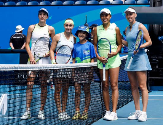 (260131) -- MELBOURNE, Jan. 31, 2026 -- Zhang Shuai (2nd R) Elise Mertens (1st R) and Anna Danilina (1st L) Aleksandra Krunic (2nd L) pose for photos with a ballkid before the women s doubles final match between Zhang Shuai (China) Elise Mertens (Belgium) and Anna Danilina (Kazakhstan) Aleksandra Krunic (Serbia) at the Australian Open tennis tournament in Melbourne, Australia, Jan. 31, 2026. ) (SP)AUSTRALIA-MELBOURNE-TENNIS-AUSTRALIAN OPEN-WOMEN S DOUBLES-FINAL MaxPing 