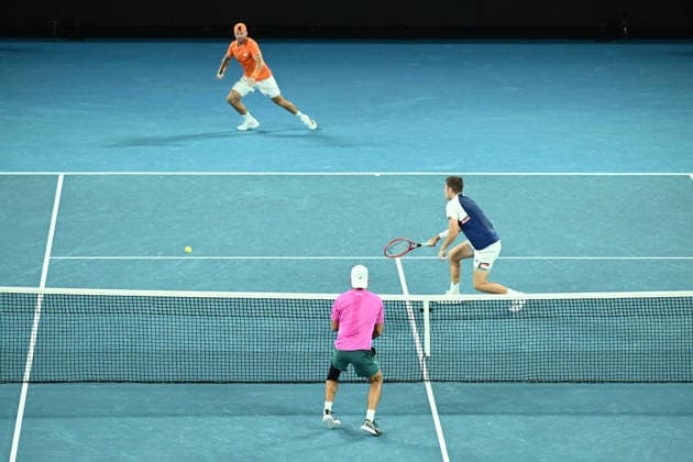 TENNIS AUSTRALIAN OPEN, Christian Harrison (orange) of the USA and Neal Skupski (blue) of Great Britian in action during the men™s doubles final against Jason Kubler (pink) and Marc Polmans (red) of Australia on day 14 of the 2026 Australian Open tennis tournament at Melbourne Park in Melbourne, Saturday, January 31, 2026. ( NO ARCHIVING MELBOURNE VICTORIA AUSTRALIA  Copyright: xJOELxCARRETTx 20260131149426979738